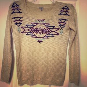 Pretty beige sweater with sparkle detail!